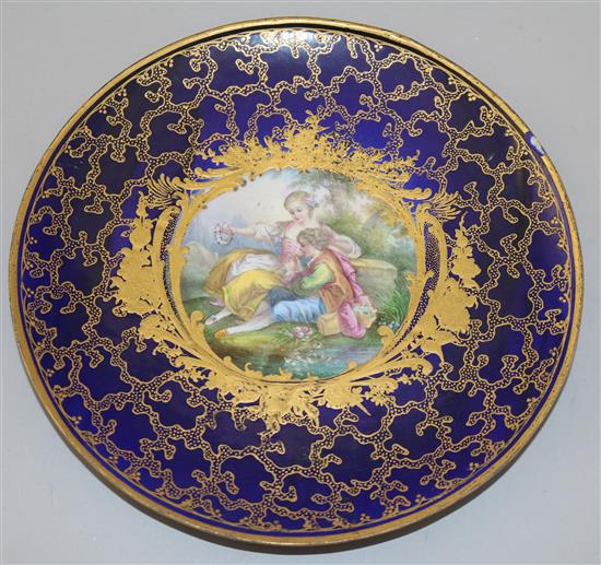 A Sevres style plate, possibly an 18th century blank later decorated 24.5cm